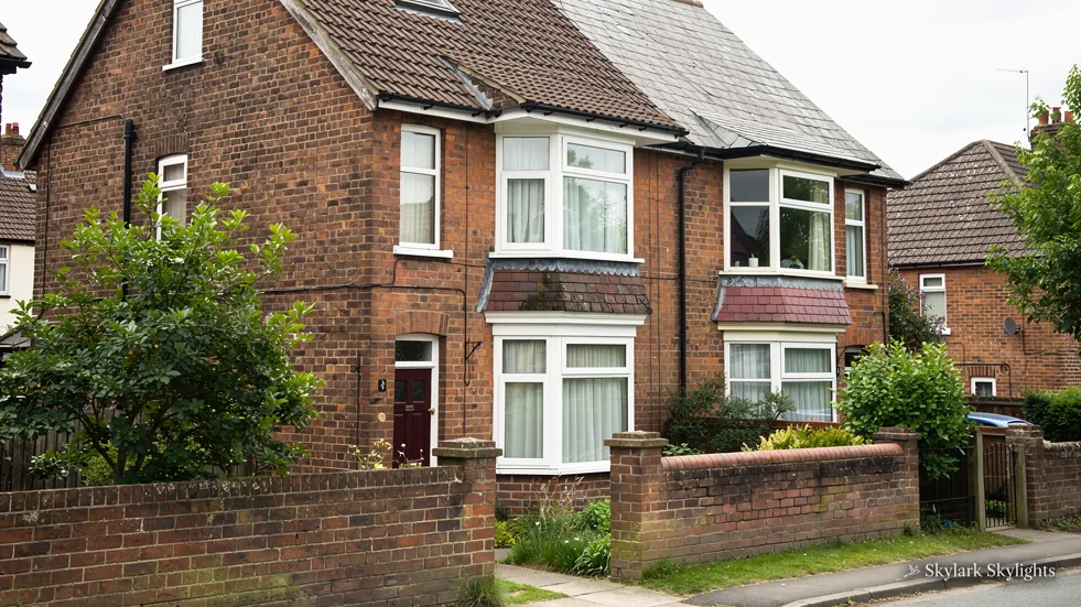 Brick semis with bay windows and front gardens