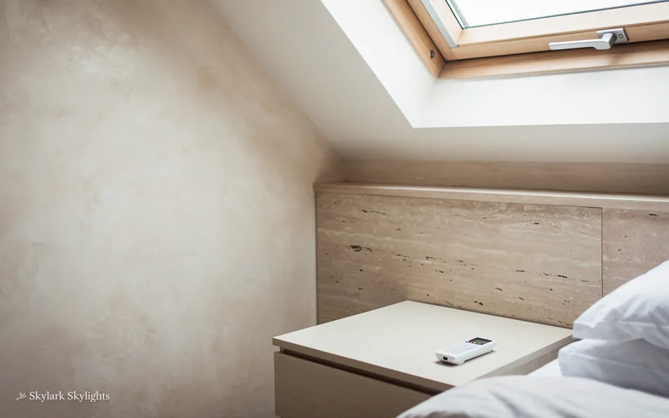 Corner of a loft room under a roof window