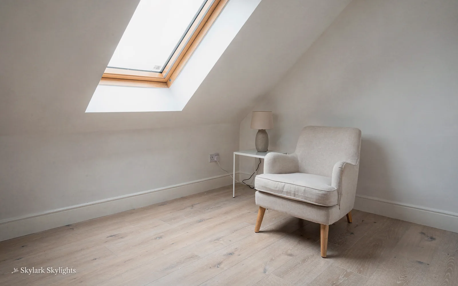 Armchair in the corner of a plain attic room