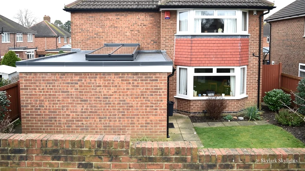 Brick semi with a flat-roofed side extension and rooflight